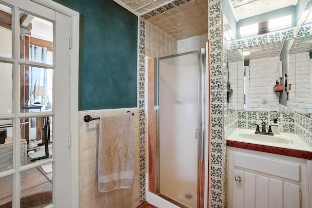 1402A Bishops Lodge Rd, Santa Fe, NM 87506 - bathroom featuring a shower stall, vanity, and tile walls
