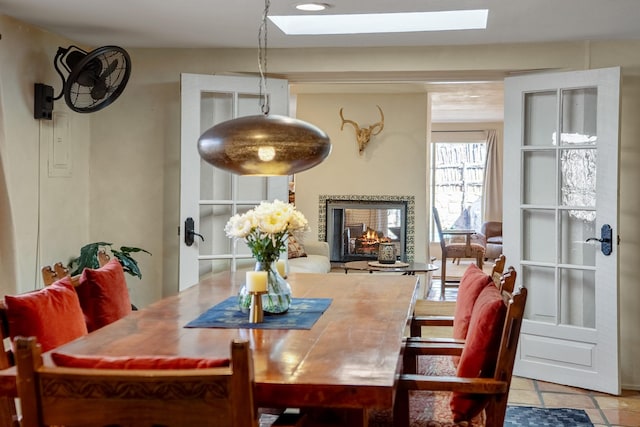 1402A Bishops Lodge Rd, Santa Fe, NM 87506 - dining space with a skylight and a multi sided fireplace