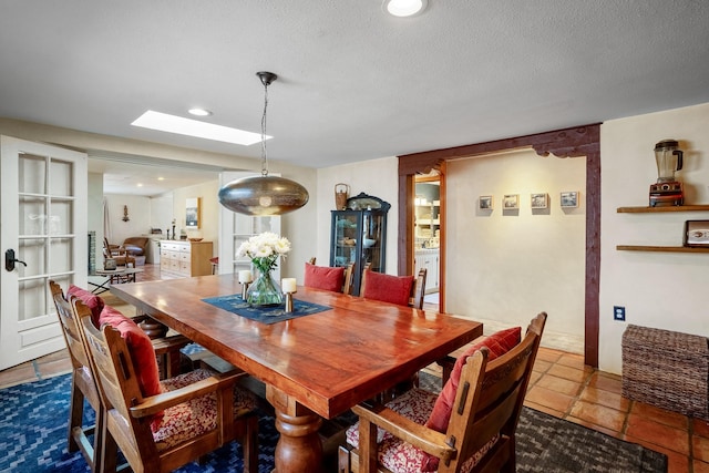 1402A Bishops Lodge Rd, Santa Fe, NM 87506 - dining space with a skylight, a textured ceiling, and recessed lighting