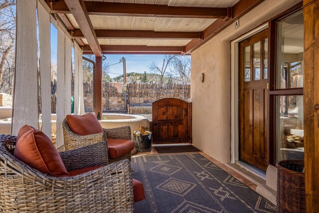 1402A Bishops Lodge Rd, Santa Fe, NM 87506 - sunroom featuring wood ceiling with exposed beams