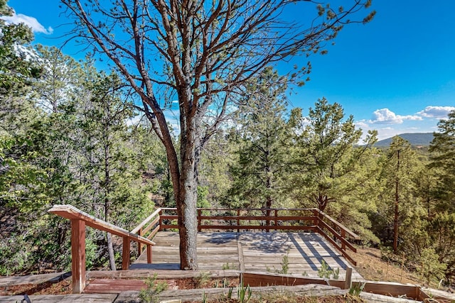 97 Quartz Trl, Santa Fe, NM 87505 - view of yard featuring a view of trees and a deck