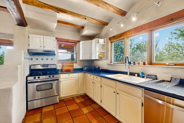 97 Quartz Trl, Santa Fe, NM 87505 - kitchen featuring appliances with stainless steel finishes, under cabinet range hood, a sink, tile patterned flooring, and beamed ceiling