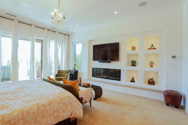 974 Old Santa Fe Trl, Santa Fe, NM 87505 - carpeted bedroom with a chandelier, a glass covered fireplace, and recessed lighting