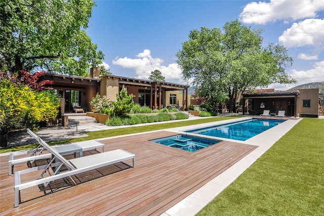 974 Old Santa Fe Trl, Santa Fe, NM 87505 - back of house featuring a wooden deck, an outdoor hot tub, an outdoor pool, and a yard