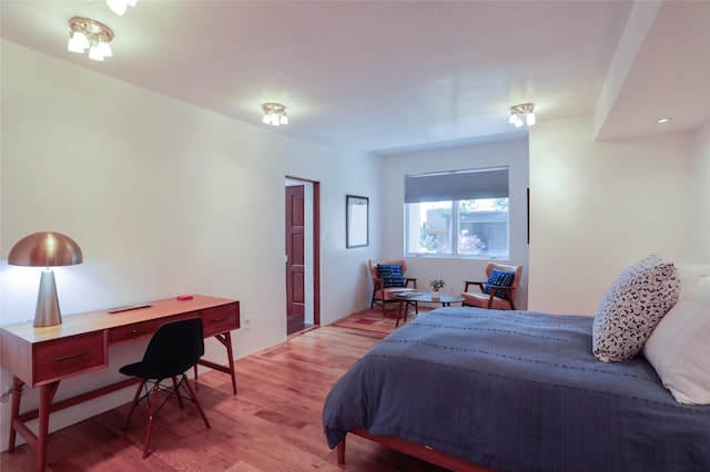 974 Old Santa Fe Trl, Santa Fe, NM 87505 - bedroom with light wood finished floors and a desk