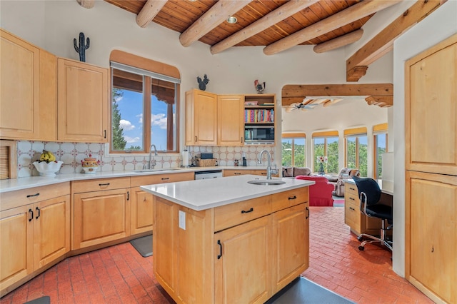 17 Alteza, Santa Fe, NM 87508 - kitchen with a wooden ceiling with exposed beams, light brown cabinets, brick floors, stainless steel appliances, and a center island with sink