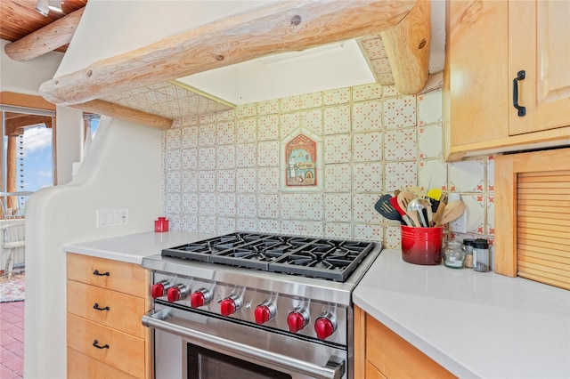17 Alteza, Santa Fe, NM 87508 - kitchen with stainless steel range, ventilation hood, decorative backsplash, light brown cabinets, and light countertops