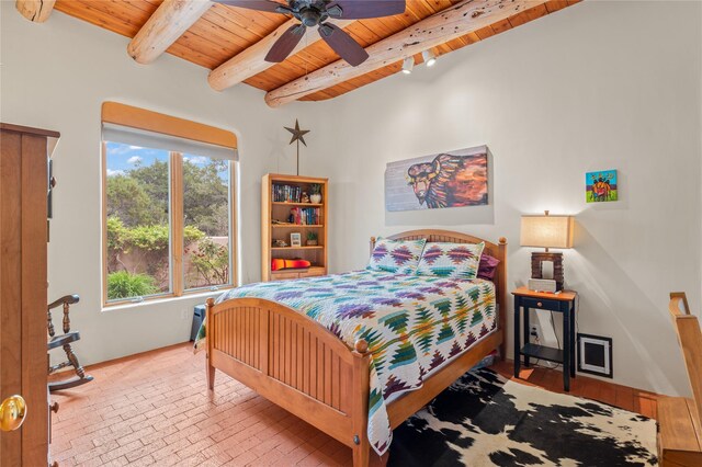 17 Alteza, Santa Fe, NM 87508 - bedroom with a wood ceiling with exposed beams, brick patterned flooring, and ceiling fan
