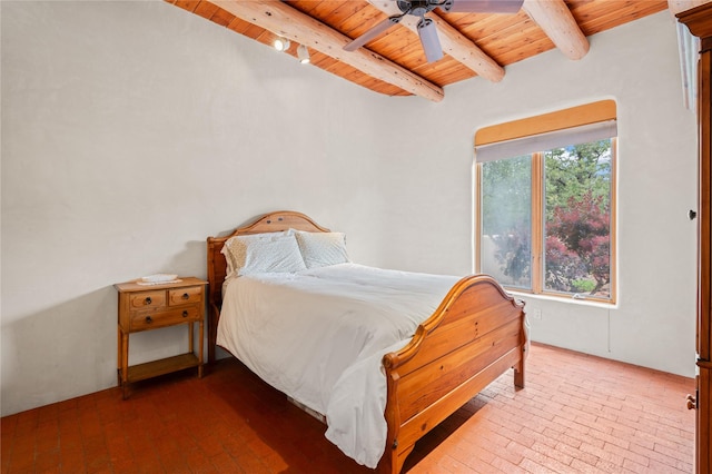 17 Alteza, Santa Fe, NM 87508 - bedroom with a wood ceiling with exposed beams, brick floors, and ceiling fan
