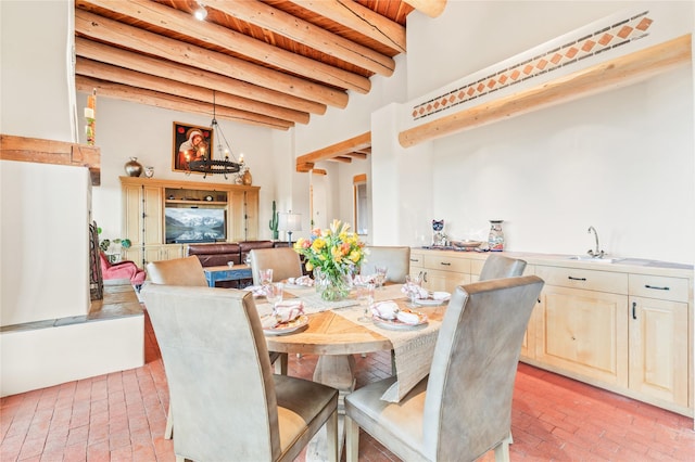 17 Alteza, Santa Fe, NM 87508 - dining room featuring brick flooring and a wooden ceiling with exposed beams