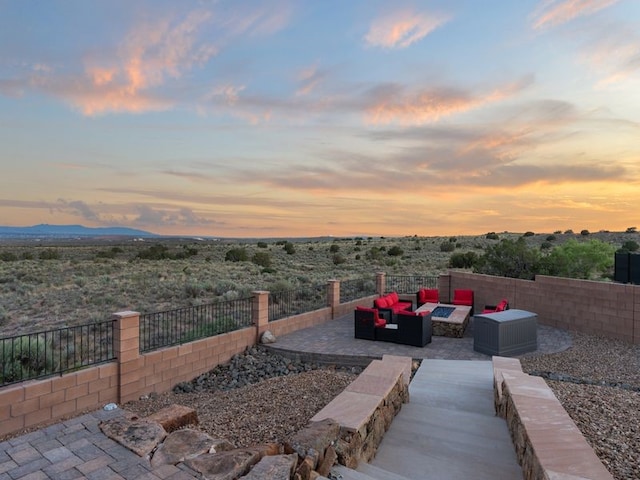 2324 Venada Rd, Rio Rancho, NM 87144 - yard at dusk featuring an outdoor hangout area and a patio