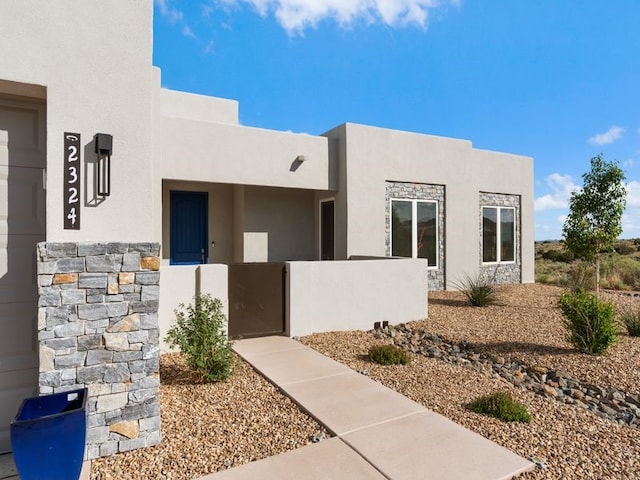 2324 Venada Rd, Rio Rancho, NM 87144 - property entrance with stucco siding and a gate