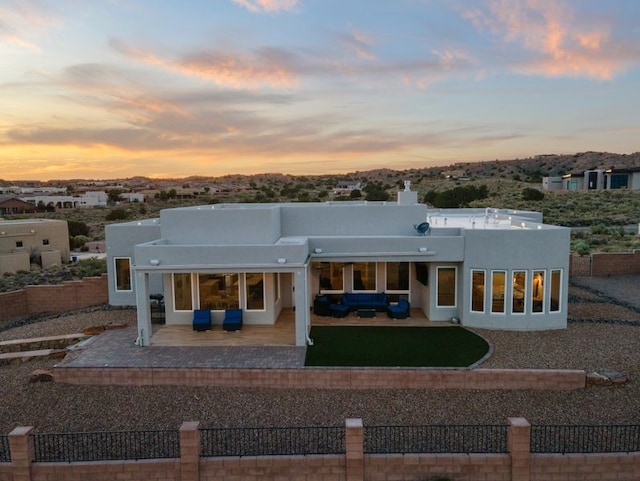 2324 Venada Rd, Rio Rancho, NM 87144 - rear view of property featuring an outdoor living space, stucco siding, and a patio area