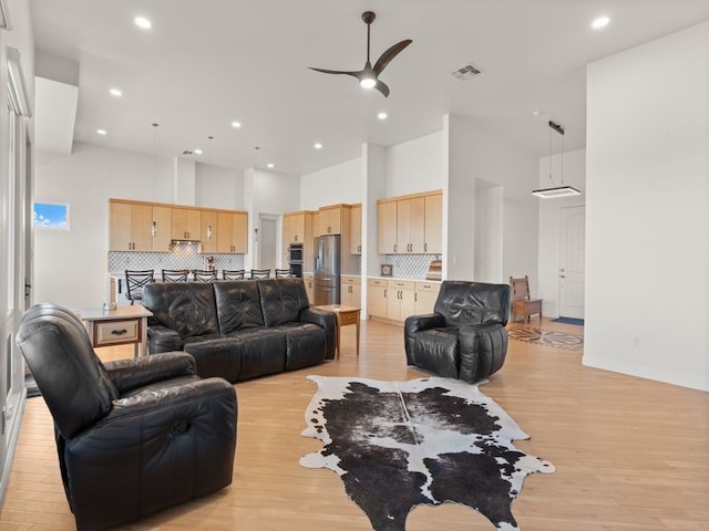 2324 Venada Rd, Rio Rancho, NM 87144 - living area with a ceiling fan, light wood finished floors, recessed lighting, and a high ceiling