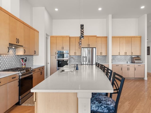 2324 Venada Rd, Rio Rancho, NM 87144 - kitchen featuring appliances with stainless steel finishes, light brown cabinetry, decorative backsplash, and recessed lighting