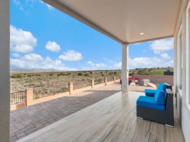 2324 Venada Rd, Rio Rancho, NM 87144 - wooden terrace featuring a patio and a view of rural / pastoral area
