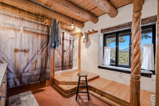 7675 Old Santa Fe Unit C, Santa Fe, NM 87505 - bathroom featuring a wood ceiling with exposed beams and brick flooring