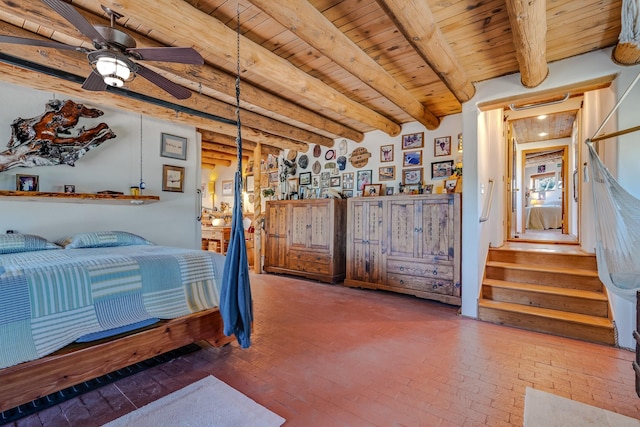 7675 Old Santa Fe Unit C, Santa Fe, NM 87505 - bedroom with brick flooring and a wooden ceiling with exposed beams
