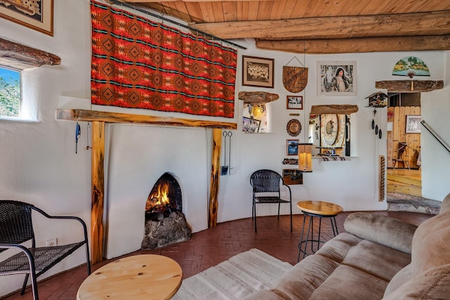 7675 Old Santa Fe Unit C, Santa Fe, NM 87505 - living room featuring brick flooring and a wooden ceiling with exposed beams