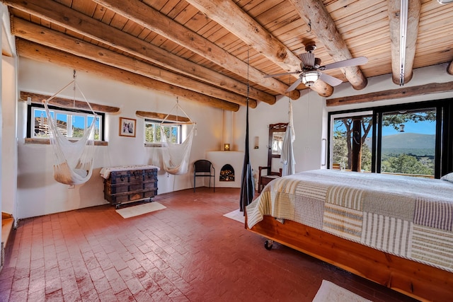 7675 Old Santa Fe Unit C, Santa Fe, NM 87505 - bedroom with a wooden ceiling with exposed beams and brick flooring