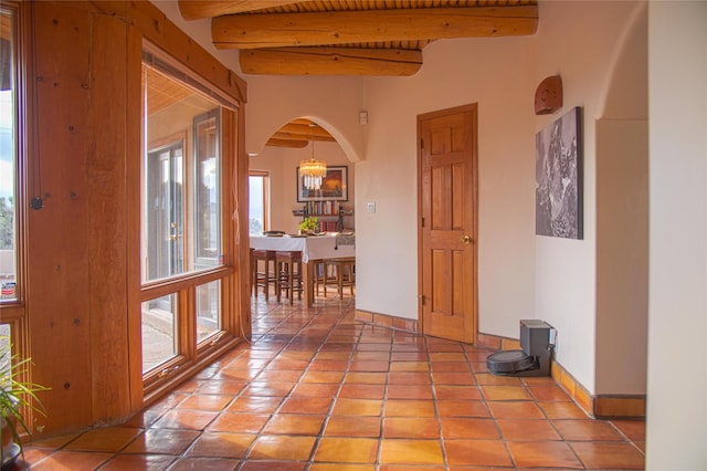 7 Paseo De Rincon, Santa Fe, NM 87508 - hall featuring beamed ceiling, arched walkways, and light tile patterned flooring