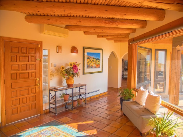 7 Paseo De Rincon, Santa Fe, NM 87508 - entryway with an AC wall unit, arched walkways, tile patterned flooring, and beamed ceiling