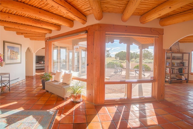 7 Paseo De Rincon, Santa Fe, NM 87508 - entryway with arched walkways, a wooden ceiling with exposed beams, tile patterned flooring, and a baseboard heating unit