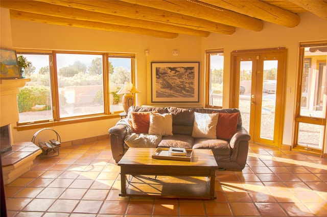 7 Paseo De Rincon, Santa Fe, NM 87508 - living room with light tile patterned flooring, healthy amount of natural light, and beamed ceiling