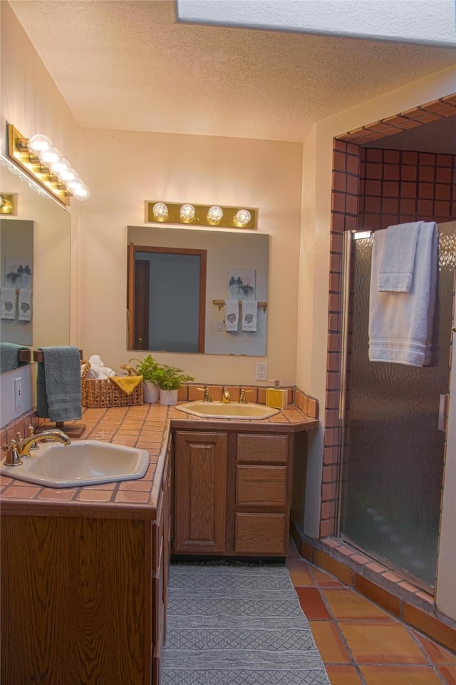 7 Paseo De Rincon, Santa Fe, NM 87508 - bathroom featuring double vanity, a shower with door, and tile patterned flooring