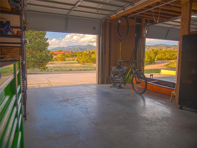 7 Paseo De Rincon, Santa Fe, NM 87508 - garage featuring a mountain view