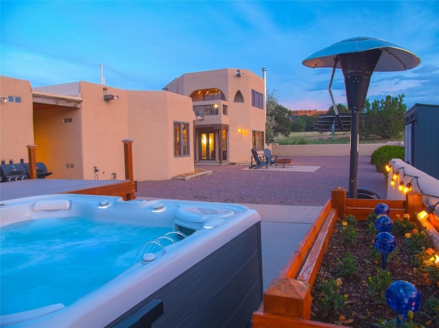 7 Paseo De Rincon, Santa Fe, NM 87508 - exterior space featuring a hot tub, a patio, and stucco siding