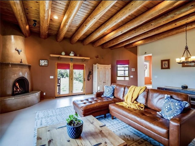 14 Dulce Rd, Santa Fe, NM 87508 - living area featuring finished concrete flooring, a wooden ceiling with exposed beams, a chandelier, and a large fireplace