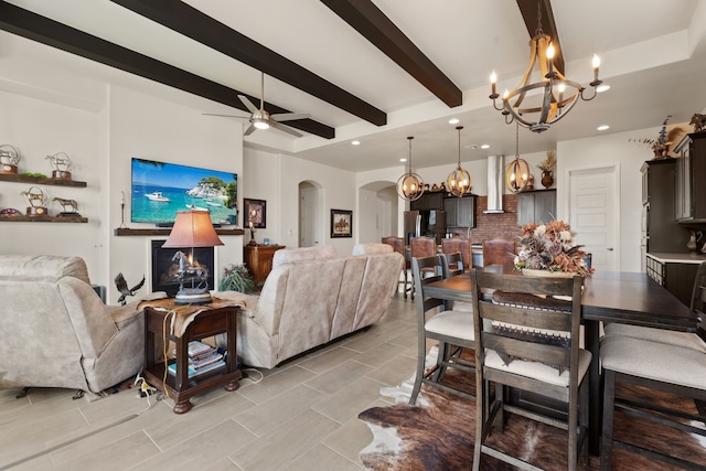 6816 Cleary Loop NE, Rio Rancho, NM 87144 - living room featuring a chandelier, arched walkways, beam ceiling, a ceiling fan, and recessed lighting