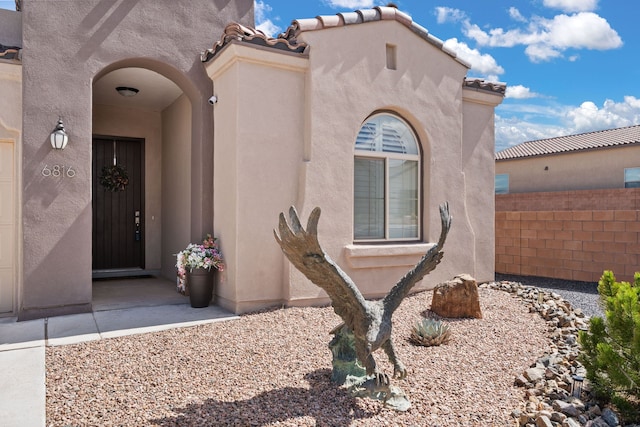 6816 Cleary Loop NE, Rio Rancho, NM 87144 - entrance to property with stucco siding and a tiled roof