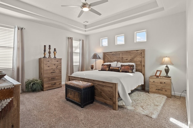 6816 Cleary Loop NE, Rio Rancho, NM 87144 - carpeted bedroom featuring a raised ceiling and ceiling fan