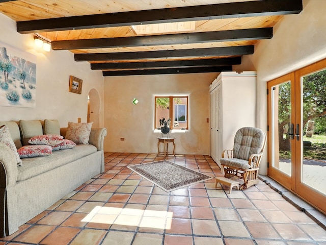 31AB Hondo Trl, Santa Fe, NM 87508 - living area with arched walkways, a wooden ceiling with exposed beams, french doors, and light tile patterned floors