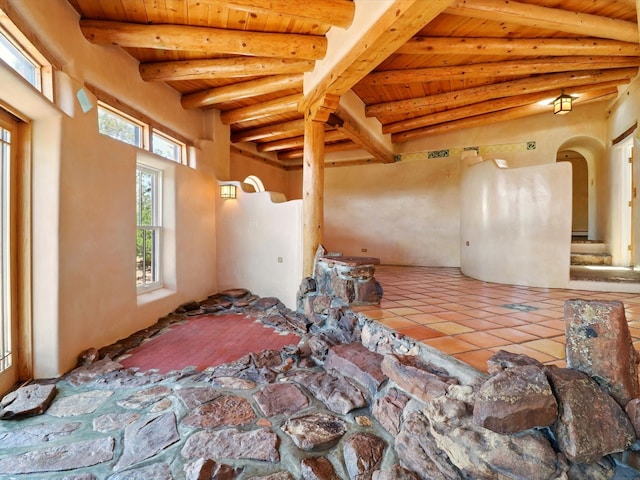 31AB Hondo Trl, Santa Fe, NM 87508 - misc room featuring a wooden ceiling with exposed beams and tile patterned floors