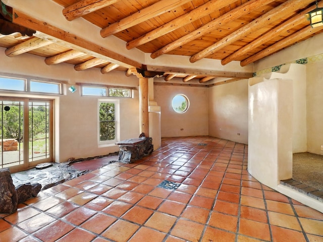 31AB Hondo Trl, Santa Fe, NM 87508 - spare room with light tile patterned flooring and a wood ceiling with exposed beams
