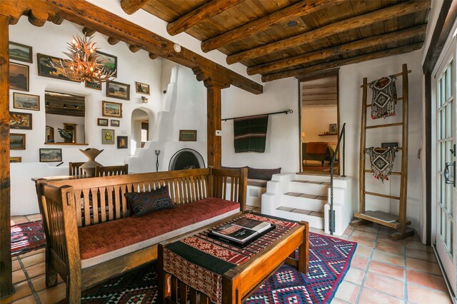 576 Camino Del Monte Sol, Santa Fe, NM 87505 - tiled dining area featuring a wood ceiling with exposed beams, a chandelier, and arched walkways