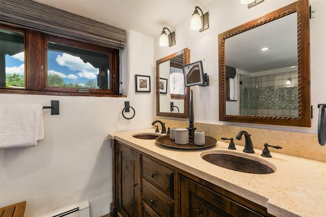 576 Camino Del Monte Sol, Santa Fe, NM 87505 - bathroom featuring double vanity, a tile shower, and baseboard heating