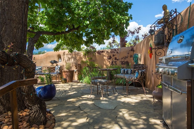 576 Camino Del Monte Sol, Santa Fe, NM 87505 - fenced backyard featuring outdoor dining area and a patio