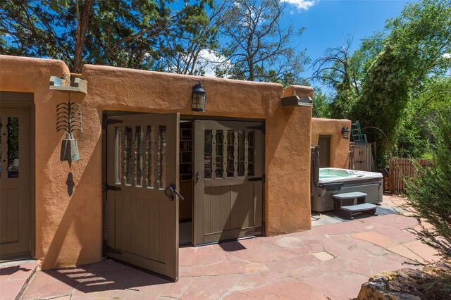 576 Camino Del Monte Sol, Santa Fe, NM 87505 - doorway to property featuring stucco siding