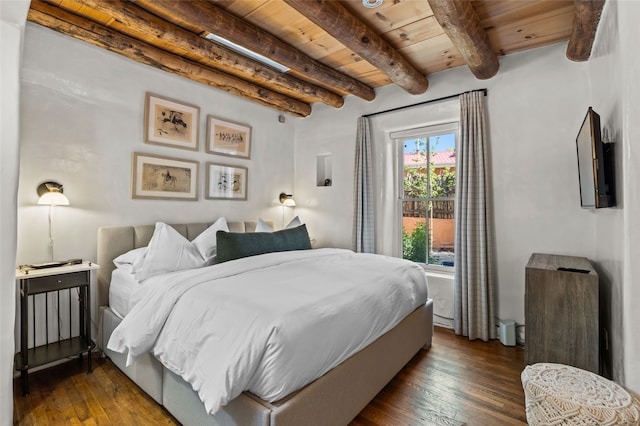 507 Acequia Madre, Santa Fe, NM 87505 - bedroom featuring a wooden ceiling with exposed beams and dark wood finished floors