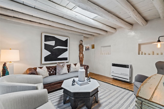 507 Acequia Madre, Santa Fe, NM 87505 - living area with heating unit, a wood ceiling with exposed beams, and wood finished floors