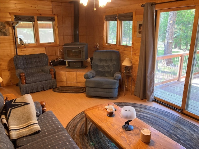 9 Bear Rd, Chama, NM 87520 - living area featuring plenty of natural light, a wood stove, and wood walls