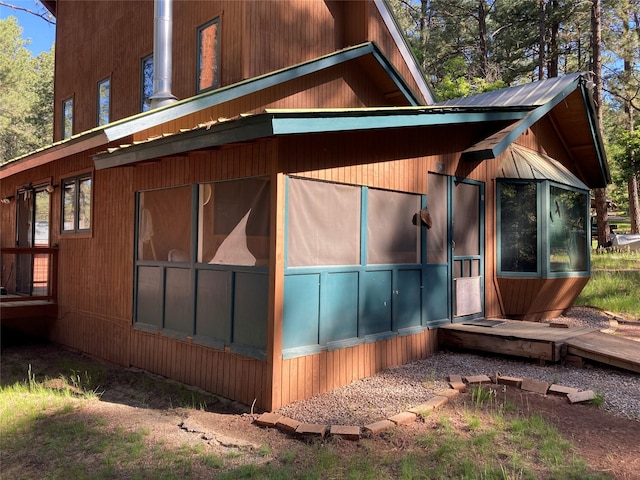 9 Bear Rd, Chama, NM 87520 - view of home's exterior with a sunroom