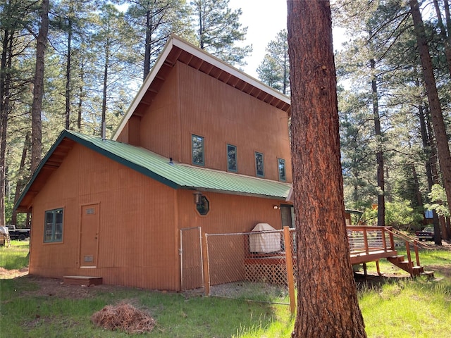9 Bear Rd, Chama, NM 87520 - view of side of property with a deck and a metal roof