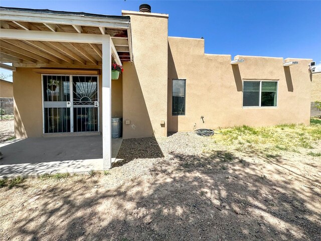 3301 Camino Prado Vis, Santa Fe, NM 87507 - rear view of property with a patio area and stucco siding