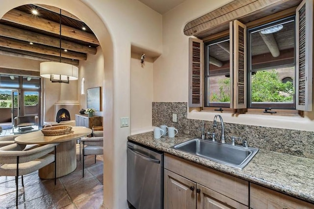 16 Plazuela Intimo, Santa Fe, NM 87506 - kitchen with dishwasher, beam ceiling, healthy amount of natural light, backsplash, and hanging light fixtures