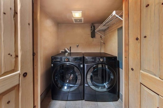 16 Plazuela Intimo, Santa Fe, NM 87506 - laundry area with washer and dryer and tile patterned flooring